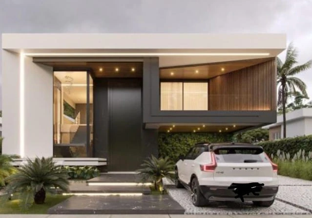 Construcción de vivienda unifamiliar con fachada minimalista de líneas rectas y acabados en madera y gris.